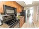Updated kitchen features stainless appliances, wood cabinets and granite countertops at 1105 S Ocean Blvd. # 932, Myrtle Beach, SC 29577