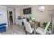 Inviting living area featuring a dining table, a TV, and access to the outdoors at 1105 S Ocean Blvd. # 932, Myrtle Beach, SC 29577
