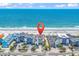 Aerial view of condos on a sunny day, perfectly located on a beautiful beach at 1119 S Ocean Blvd. # 8, Surfside Beach, SC 29575