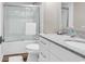 Modern bathroom with glass shower, white vanity and marble countertop at 1119 S Ocean Blvd. # 8, Surfside Beach, SC 29575