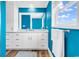 Bright bathroom features modern vanity with ample storage, granite countertop and wood flooring at 1119 S Ocean Blvd. # 8, Surfside Beach, SC 29575