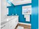 Bright bathroom with modern vanity, large mirror, and a window providing natural light and ventilation at 1119 S Ocean Blvd. # 8, Surfside Beach, SC 29575