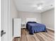 Comfortable bedroom offers hardwood floors, ceiling fan, and closet space at 1119 S Ocean Blvd. # 8, Surfside Beach, SC 29575