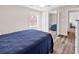 Well-lit bedroom showing mirrored closet doors and hardwood floors at 1119 S Ocean Blvd. # 8, Surfside Beach, SC 29575