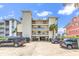 South Shores building featuring parking, balconies, and a sign at 1119 S Ocean Blvd. # 8, Surfside Beach, SC 29575
