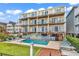 Multi-story beach house featuring multiple balconies, a private pool, and manicured lawn for outdoor enjoyment at 1119 S Ocean Blvd. # 8, Surfside Beach, SC 29575