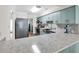 Bright kitchen showcases quartz countertops, stainless steel appliances, and plenty of cabinet space for storage at 1119 S Ocean Blvd. # 8, Surfside Beach, SC 29575
