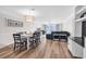 Spacious living and dining area boasting hardwood floors and abundant natural light at 1119 S Ocean Blvd. # 8, Surfside Beach, SC 29575