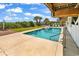 Inviting outdoor pool with clear water, surrounded by lush greenery and lounge chairs under a sunny sky at 1119 S Ocean Blvd. # 8, Surfside Beach, SC 29575
