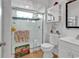 Bathroom featuring a glass shower, toilet, and flamingo-themed decor at 1125 Camellia Dr., Surfside Beach, SC 29575