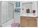 Bathroom featuring shower, vanity, mirror, and tropical decor at 1125 Camellia Dr., Surfside Beach, SC 29575