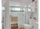 Bathroom featuring a glass shower, toilet, and flamingo-themed decor at 1125 Camellia Dr., Surfside Beach, SC 29575