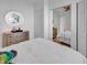 Bedroom with mirrored closet doors and a round mirror at 1125 Camellia Dr., Surfside Beach, SC 29575