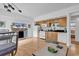 Open kitchen featuring hardwood floors, white appliances, and light wood cabinets at 1125 Camellia Dr., Surfside Beach, SC 29575