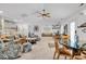 Open living room with comfortable seating, coastal decor, and ample natural light from window shutters at 1125 Camellia Dr., Surfside Beach, SC 29575