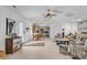 Open concept living area leads to the kitchen with neutral colors, ceiling fan, and access to the front door at 1125 Camellia Dr., Surfside Beach, SC 29575