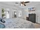 Comfortable bedroom featuring neutral tones, natural light, TV, and dark wood dresser at 1125 Camellia Dr., Surfside Beach, SC 29575