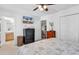 Bedroom with neutral tones, a large dark wood dresser, and attached bathroom with tile flooring at 1125 Camellia Dr., Surfside Beach, SC 29575