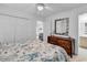 Bedroom with carpet floors and an ensuite bathroom, located adjacent to walk-in closet at 1125 Camellia Dr., Surfside Beach, SC 29575