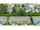Aerial view of townhouse complex showcasing colorful exteriors and lush landscaping at 1200 5Th Ave. N # 1207, Surfside Beach, SC 29575