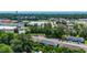 Aerial view of a condo community surrounded by lush trees with a pond in the background and assigned parking spaces for residents at 1200 5Th Ave. N # 1207, Surfside Beach, SC 29575