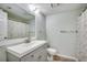 Bathroom featuring modern vanity and mirror, and shower with curtain at 1200 5Th Ave. N # 1207, Surfside Beach, SC 29575