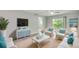 Comfortable living room with ceiling fan, tv, and sliding doors at 1200 5Th Ave. N # 1207, Surfside Beach, SC 29575