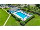 Aerial view of a beautiful community pool with plenty of lounge chairs and outdoor seating, perfect for entertaining guests at 1200 5Th Ave. N # 1207, Surfside Beach, SC 29575