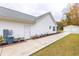 Attractive backyard with a paved walkway, green lawn, and detached garage at 1200 Bergen Dr., Loris, SC 29569