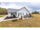 Relaxing backyard with a patio area, outdoor seating, and a luxurious hot tub, perfect for enjoying the outdoors at 1200 Bergen Dr., Loris, SC 29569