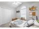 Bright bedroom featuring a ceiling fan, neutral walls, a large window and closet for ample storage at 1200 Bergen Dr., Loris, SC 29569