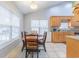 Bright dining area with natural light streaming through the windows creating a warm atmosphere at 1200 Bergen Dr., Loris, SC 29569