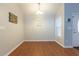 Bright dining room featuring hardwood floors, neutral walls, and a pendant light fixture at 1200 Bergen Dr., Loris, SC 29569