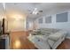 Open-concept living room featuring vaulted ceilings, hardwood floors, and a comfortable sectional sofa at 1200 Bergen Dr., Loris, SC 29569