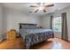 Comfortable main bedroom with hardwood floors, ceiling fan, and natural light at 1200 Bergen Dr., Loris, SC 29569