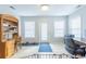 Versatile office space featuring tiled floors, a back door, and built-in shelving at 1200 Bergen Dr., Loris, SC 29569