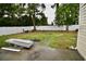 View of back yard featuring a white fence and grass and paver landscaping at 126 Clovis Circle, Myrtle Beach, SC 29579