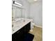 Bathroom featuring a double sink vanity, large mirror, toilet, and tile flooring at 126 Clovis Circle, Myrtle Beach, SC 29579