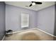 Cozy bedroom featuring a ceiling fan, carpet flooring, and a window with blinds at 126 Clovis Circle, Myrtle Beach, SC 29579