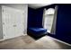 Cozy blue bedroom with a large closet and arched window at 126 Clovis Circle, Myrtle Beach, SC 29579