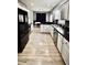 Stylish kitchen featuring white cabinets, dark countertops, stainless steel appliances and attractive, easy care floors at 126 Clovis Circle, Myrtle Beach, SC 29579