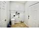 Functional laundry room featuring tile flooring, shelving and white colored walls and trim at 126 Clovis Circle, Myrtle Beach, SC 29579
