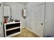 Clean laundry area with cabinets, shelving, door, and tile flooring at 126 Clovis Circle, Myrtle Beach, SC 29579
