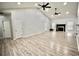 Bright, spacious living room boasting vaulted ceilings, recessed lighting, a fireplace, and durable, attractive floors at 126 Clovis Circle, Myrtle Beach, SC 29579