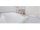Bright bathroom featuring a soaking tub, marble countertop, and a double sink vanity at 1321 Rabbit Ln., Conway, SC 29526