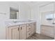 Bathroom featuring dual sinks with marble countertops and a glass shower at 1321 Rabbit Ln., Conway, SC 29526