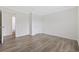 Bright bedroom featuring wood grain floors and a doorway at 1321 Rabbit Ln., Conway, SC 29526