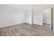 Spacious bedroom with wood-look flooring, crown molding, and convenient closet access at 1321 Rabbit Ln., Conway, SC 29526