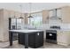 Bright kitchen features an island, stainless appliances, light wood cabinets, and a large window at 1321 Rabbit Ln., Conway, SC 29526