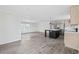 Open concept kitchen and living space featuring wood grain flooring and large windows at 1321 Rabbit Ln., Conway, SC 29526